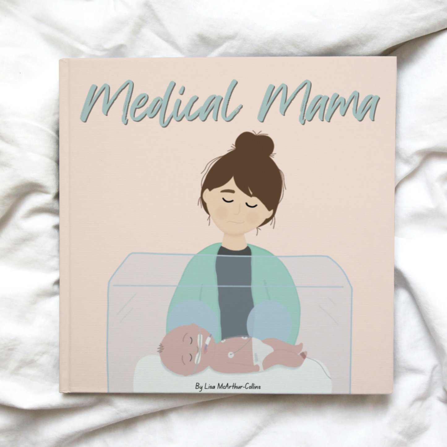 A picture book called Medical Mama lying on a white blanket