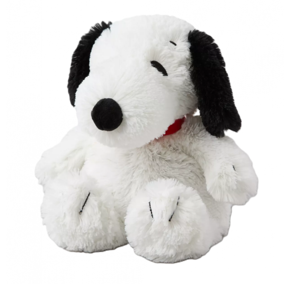 Plush toy resembling a black and white dog with a red collar on a white background